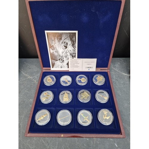 475 - Coins: four Windsor Mint gold plated coin collections; to include an Elizabeth II commemorative set ... 