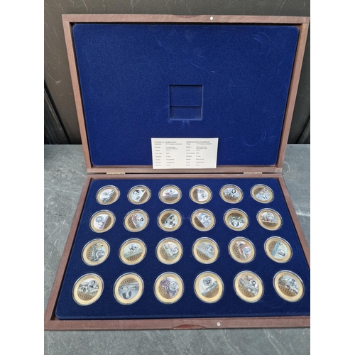 475 - Coins: four Windsor Mint gold plated coin collections; to include an Elizabeth II commemorative set ... 