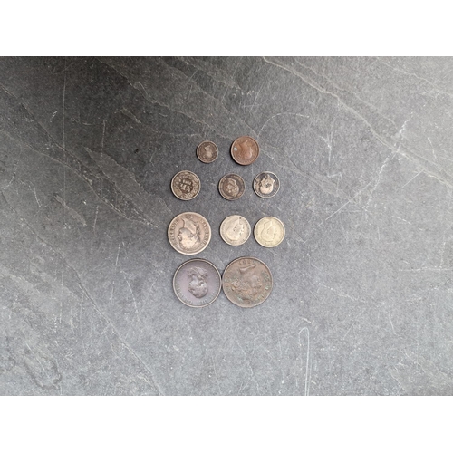 477 - Coins: a group of coins, to include: a Victoria 1838 maundy two pence; a Victoria 1886 Cyprus 1 pias... 