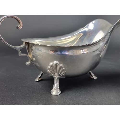 5 - A pair of silver sauce boats, by Harrison Brothers & Howson, London 1911 and Sheffield 1910, hei... 