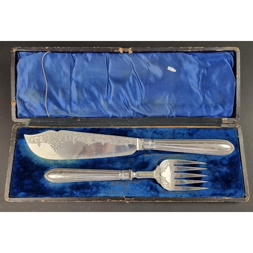 50 - A cased pair of Victorian silver fish servers, by Atkin Brothers, Sheffield 1879, handles filled.... 