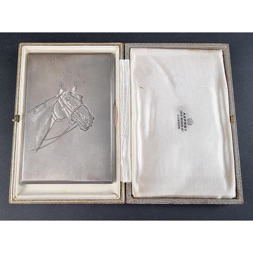 52 - A cased silver engine turned cigarette case, having engraved horse decoration, by A Wilcox, Birmingh... 