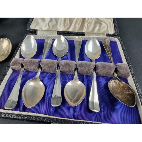 58 - A cased set of six silver teaspoons, by Sir John Bennett Ltd, London 1932; together with seven other... 