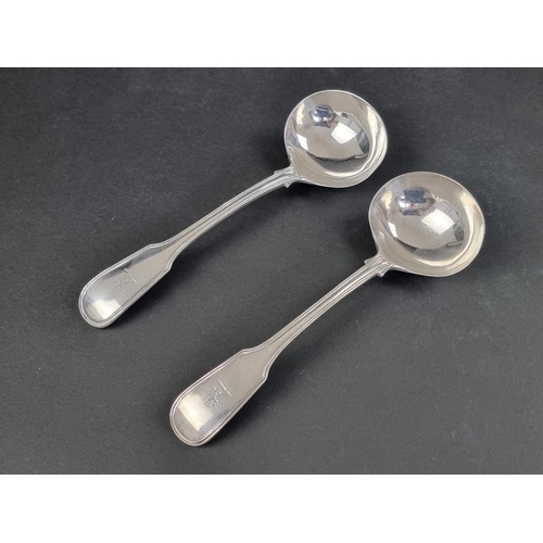 66 - A pair of Victorian silver fiddle and thread pattern sauce ladles, by Samuel Hayne & Dudley Cate... 