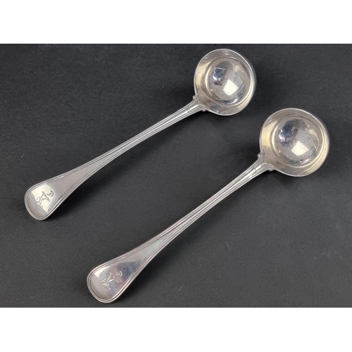 66A - A pair of Victorian Old English military thread and shell pattern silver sauce ladles, by William Ea... 