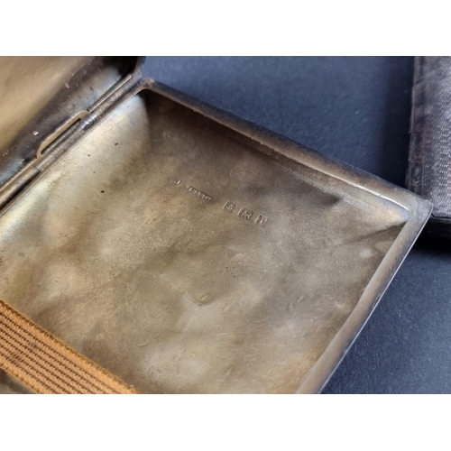 91 - An engine turned silver cigarette case, by I S Greenberg & Co, Birmingham 1933, 16.5cm wide; tog... 