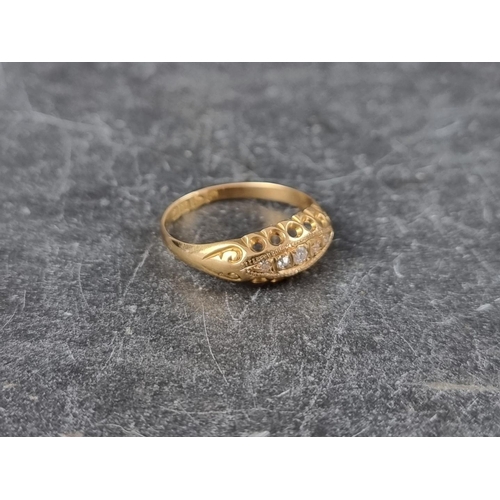 143 - An 18ct gold diamond five stone ring, in a boat shaped setting with graduated mixed cut diamonds, Ch... 