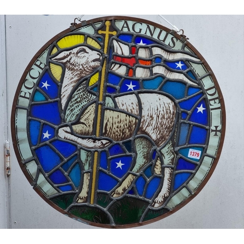 1379 - An old stained and leaded glass 'Lamb & Flag' circular panel, 54cm diameter.