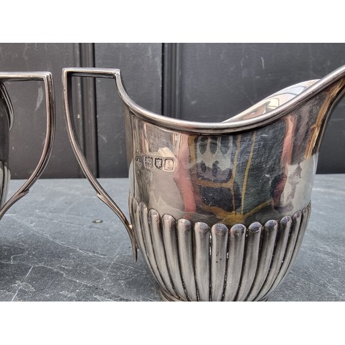 80 - A silver cream jug and matching sugar bowl, by William Hutton & Sons Ltd, London 1904, heig... 