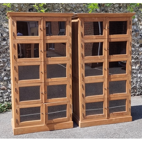 1001 - A pair of Eastern hardwood cabinets, each with five pairs of glass panelled doors, 201cm high x... 