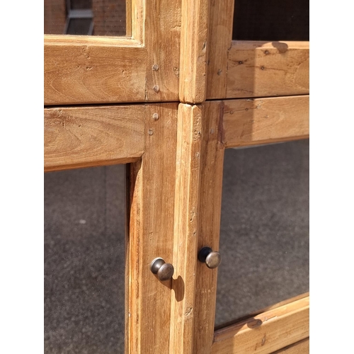 1001 - A pair of Eastern hardwood cabinets, each with five pairs of glass panelled doors, 201cm high x... 