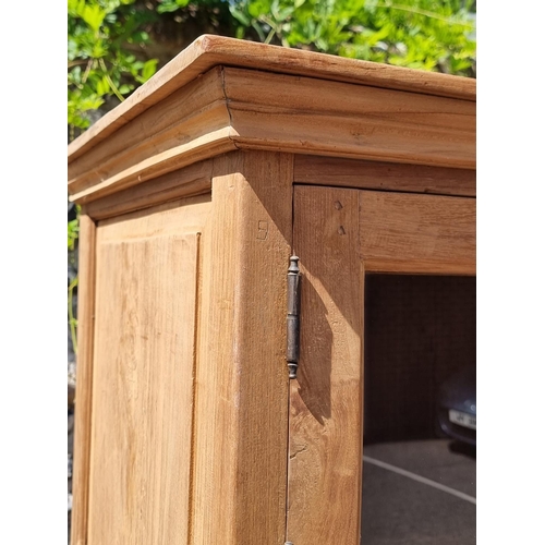 1001 - A pair of Eastern hardwood cabinets, each with five pairs of glass panelled doors, 201cm high x... 