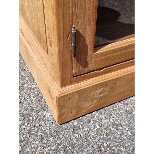 1001 - A pair of Eastern hardwood cabinets, each with five pairs of glass panelled doors, 201cm high x... 