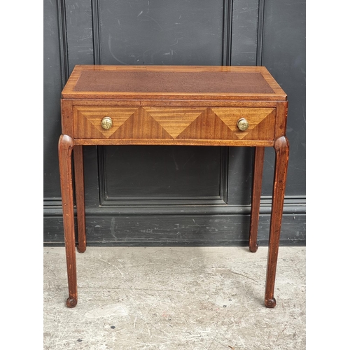 1002 - A small 1930s mahogany desk, stamped 'Waring & Gillow Ltd', 71cm wide, (faults to top).... 