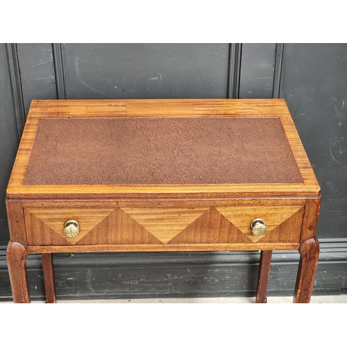 1002 - A small 1930s mahogany desk, stamped 'Waring & Gillow Ltd', 71cm wide, (faults to top).... 