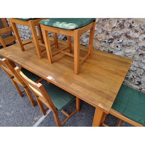 1003 - A contemporary oak dining table and six matching chairs, the table 180 x 90.5cm.... 