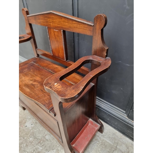 1004 - A small 1920s oak box seat settle/hall stand, 80.5cm wide.