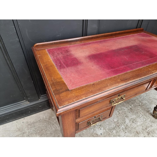 1005 - A late Victorian walnut kneehole desk, 107cm wide.