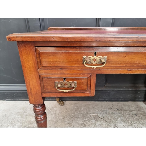 1005 - A late Victorian walnut kneehole desk, 107cm wide.