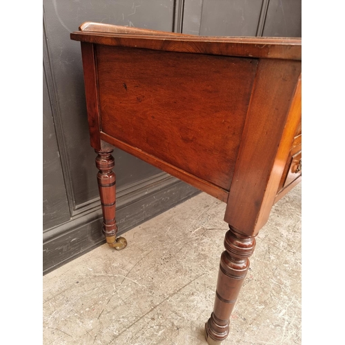 1005 - A late Victorian walnut kneehole desk, 107cm wide.