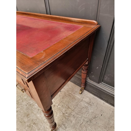 1005 - A late Victorian walnut kneehole desk, 107cm wide.