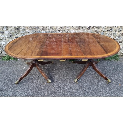 1014 - A 19th century mahogany, satinwood crossbanded and line inlaid twin pedestal dining table, stam... 