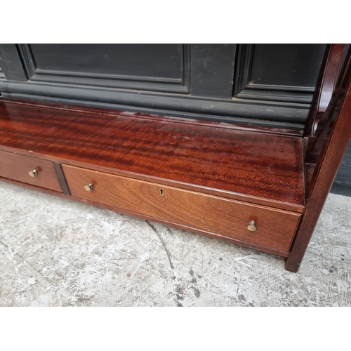 1015 - A reproduction mahogany hanging open bookcase, by Laura Ashley, 137cm high x 85cm wide.... 