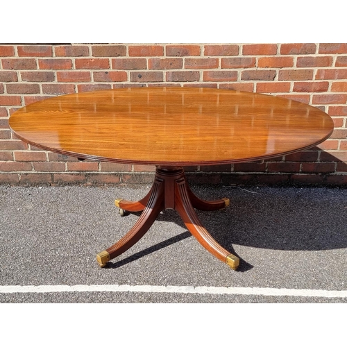 1019 - A 19th century mahogany oval tilt-top breakfast table, on reeded outswept legs, 152.5cm wide.... 