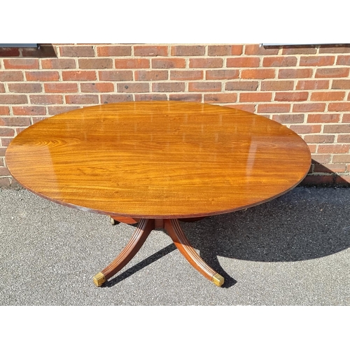 1019 - A 19th century mahogany oval tilt-top breakfast table, on reeded outswept legs, 152.5cm wide.... 