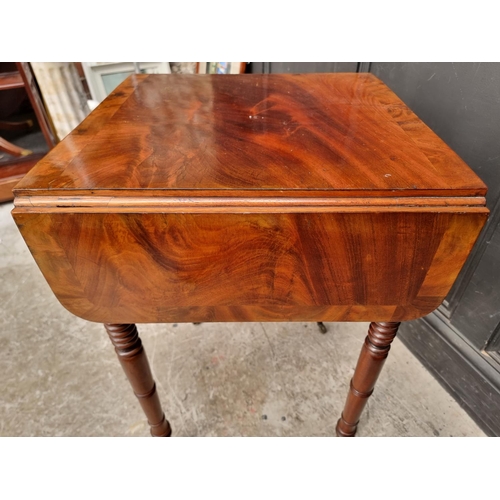 1021 - A George IV mahogany and crossbanded Pembroke work table, 79cm wide when open.