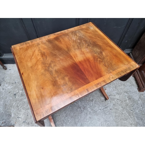 1024 - A 19th century mahogany and crossbanded sofa table, 80.5cm wide when closed.