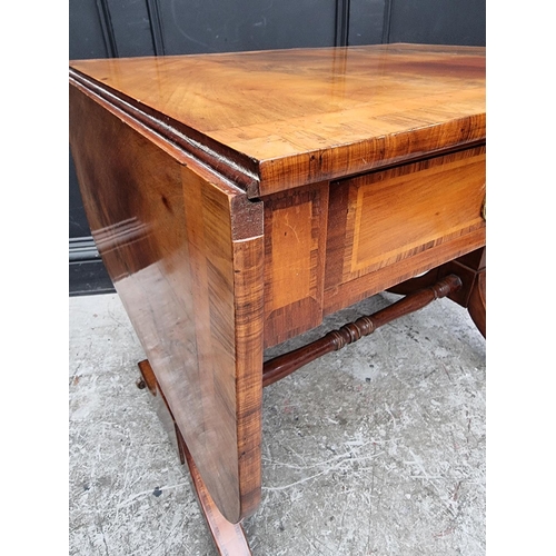 1024 - A 19th century mahogany and crossbanded sofa table, 80.5cm wide when closed.