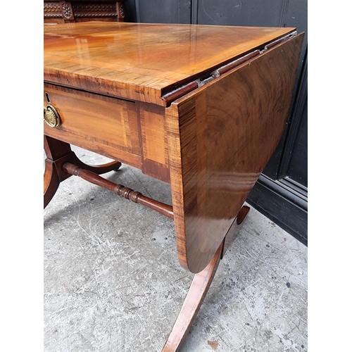 1024 - A 19th century mahogany and crossbanded sofa table, 80.5cm wide when closed.