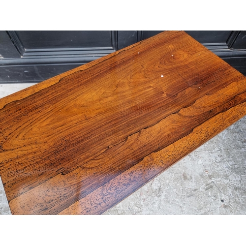 1025 - A small rosewood rectangular low occasional table, 66.5cm wide.