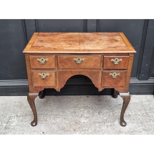 1027 - A George II walnut, feather and crossbanded lowboy, 88cm wide.