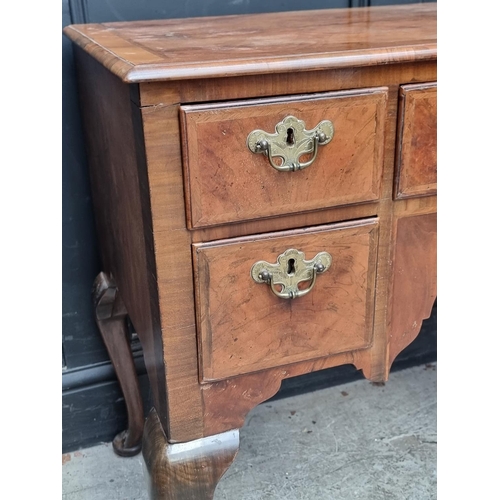 1027 - A George II walnut, feather and crossbanded lowboy, 88cm wide.