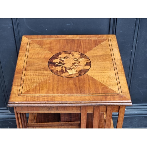 1032 - A small walnut, inlaid and tulip wood crossbanded revolving bookcase, 45cm wide.... 