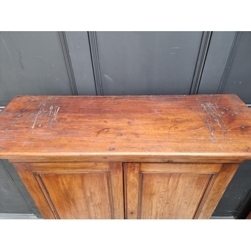 1035 - An unusual mahogany cabinet, the upper section fitted with twenty four small filing drawers, 142.5cm... 