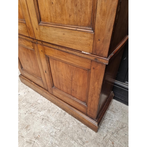 1035 - An unusual mahogany cabinet, the upper section fitted with twenty four small filing drawers, 142.5cm... 