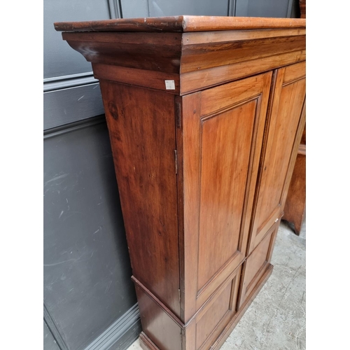 1035 - An unusual mahogany cabinet, the upper section fitted with twenty four small filing drawers, 142.5cm... 