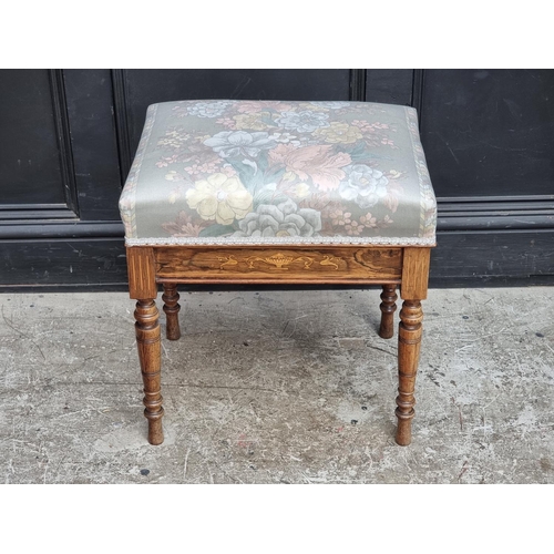 1042 - A late Victorian rosewood and inlaid piano stool, with hinged seat, 49cm wide.