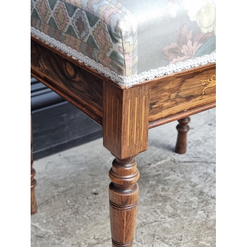 1042 - A late Victorian rosewood and inlaid piano stool, with hinged seat, 49cm wide.