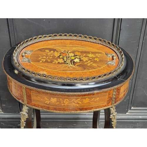 1043 - A Louis XV style burr walnut, ebonised and inlaid jardiniere, 46cm wide.