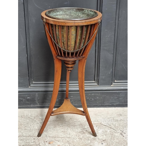 1044 - An Edwardian mahogany and line inlaid jardiniere, 35cm diameter.