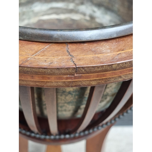 1044 - An Edwardian mahogany and line inlaid jardiniere, 35cm diameter.