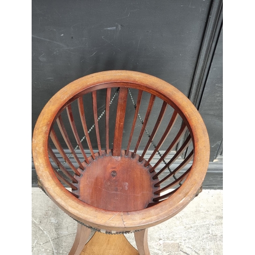 1044 - An Edwardian mahogany and line inlaid jardiniere, 35cm diameter.