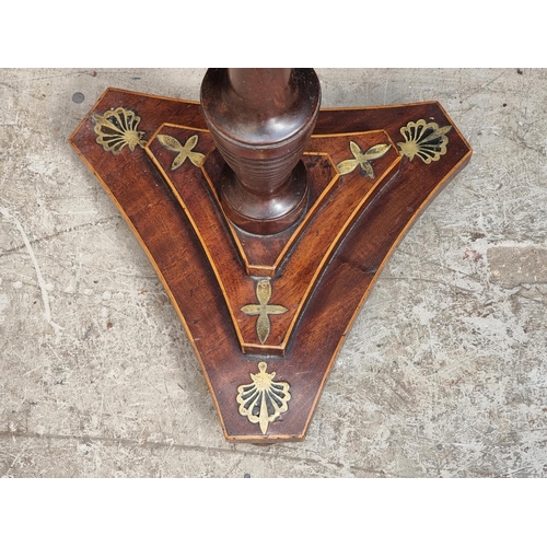 1052 - A George IV mahogany and brass pole screen, with later panel.