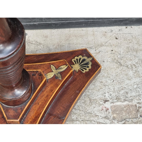 1052 - A George IV mahogany and brass pole screen, with later panel.