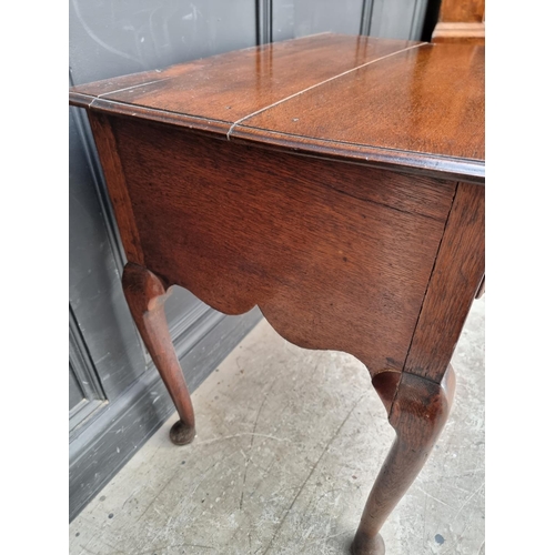 1054 - An 18th century oak lowboy, 76.5cm wide.