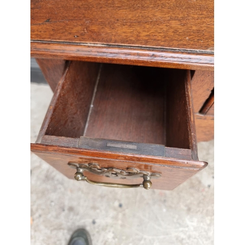 1054 - An 18th century oak lowboy, 76.5cm wide.